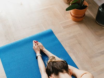 A quiet, empty yoga mat in a sunlit room.